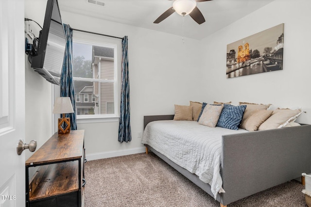 bedroom with carpet, ceiling fan, and baseboards