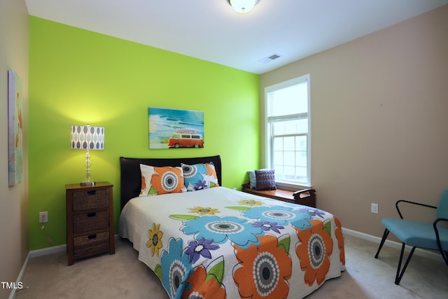 carpeted bedroom with baseboards