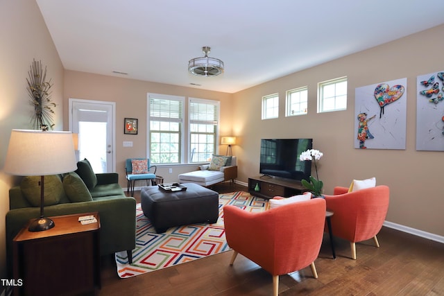 living room featuring wood finished floors and baseboards