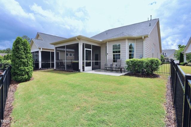 back of property with a sunroom and a patio