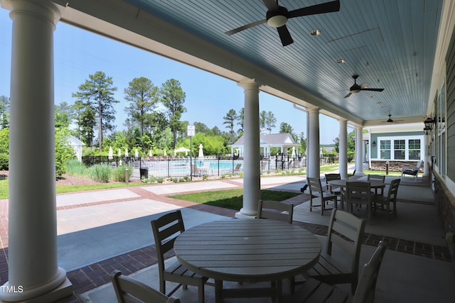 view of patio / terrace with a ceiling fan, outdoor dining area, and fence