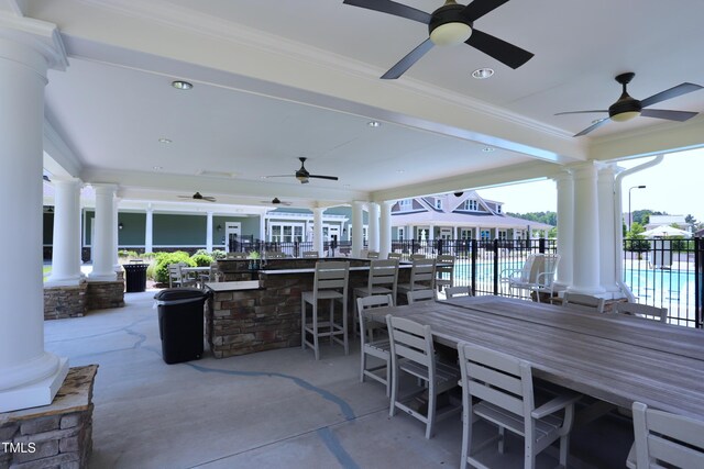 view of patio / terrace featuring fence and a ceiling fan