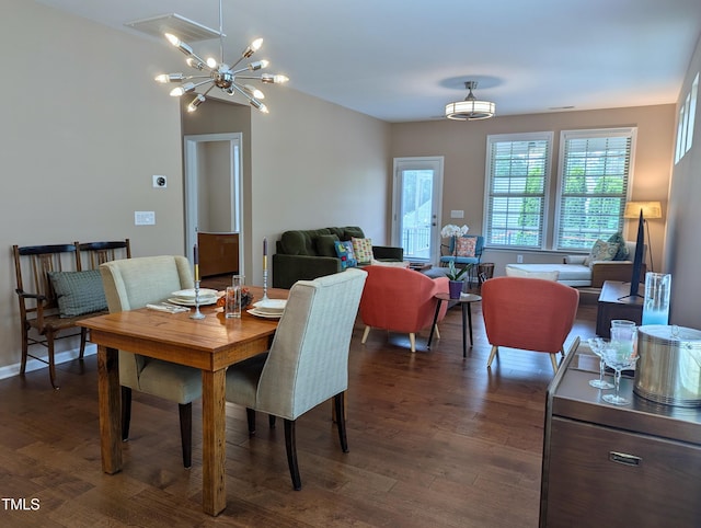 1033 Cuthbert Ln, Durham, NC 27703 - dining area featuring a chandelier and dark wood finished floors