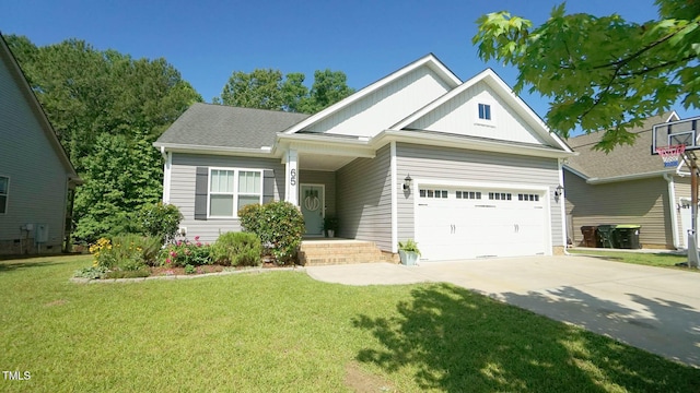 65 Wood Green Dr, Wendell, NC 27591 - view of front of property with concrete driveway, a front yard, a garage, and board and batten siding