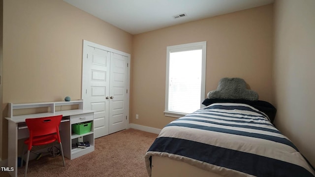 65 Wood Green Dr, Wendell, NC 27591 - carpeted bedroom with baseboards, a closet, and visible vents