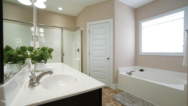 65 Wood Green Dr, Wendell, NC 27591 - bathroom with double vanity, a garden tub, a sink, a shower, and baseboards