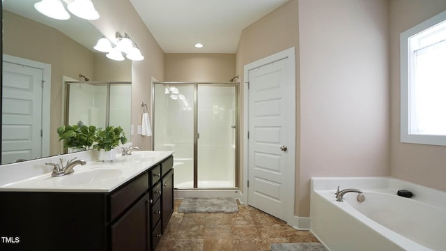 65 Wood Green Dr, Wendell, NC 27591 - bathroom featuring double vanity, a bath, a shower stall, and a sink