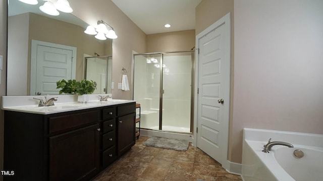 65 Wood Green Dr, Wendell, NC 27591 - bathroom featuring double vanity, a bath, a shower stall, and a sink
