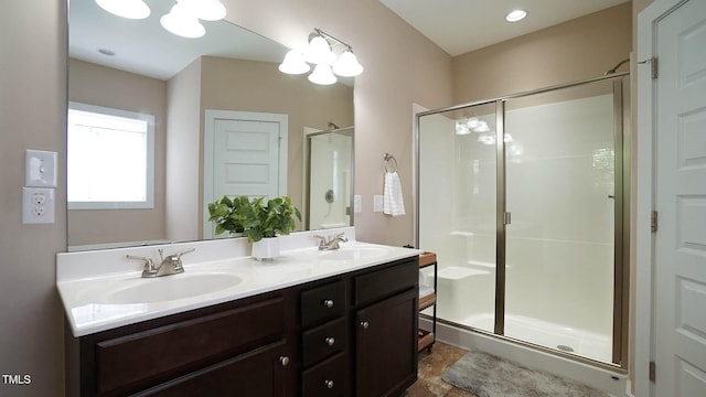 65 Wood Green Dr, Wendell, NC 27591 - full bathroom with a shower stall, double vanity, and a sink