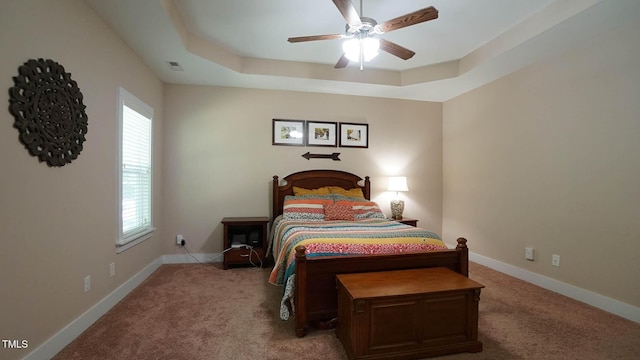 65 Wood Green Dr, Wendell, NC 27591 - bedroom with a tray ceiling, light carpet, baseboards, and ceiling fan