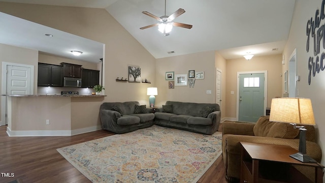 65 Wood Green Dr, Wendell, NC 27591 - living room featuring dark wood finished floors, baseboards, a ceiling fan, and high vaulted ceiling