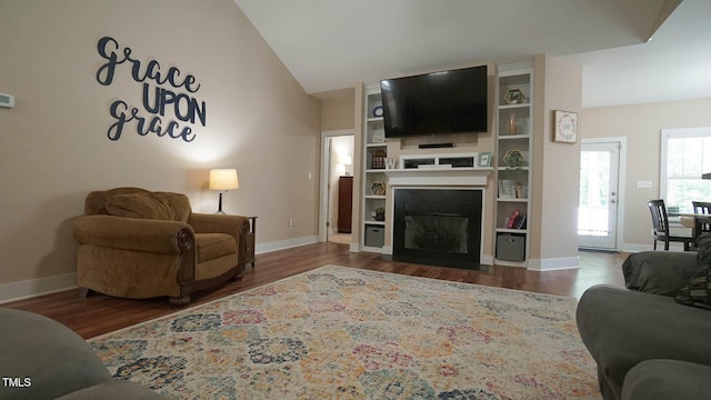 65 Wood Green Dr, Wendell, NC 27591 - living area featuring wood finished floors, baseboards, and lofted ceiling