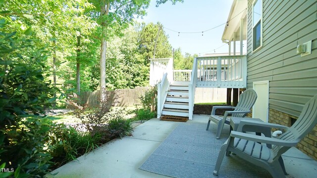 65 Wood Green Dr, Wendell, NC 27591 - view of patio featuring stairway, fence, and a deck