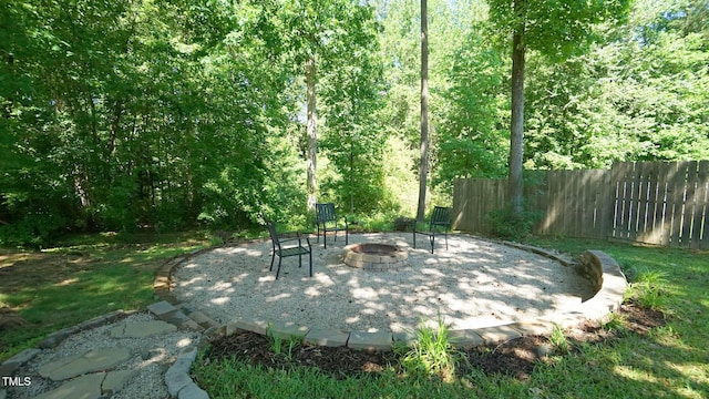 65 Wood Green Dr, Wendell, NC 27591 - view of patio / terrace with a fire pit and fence