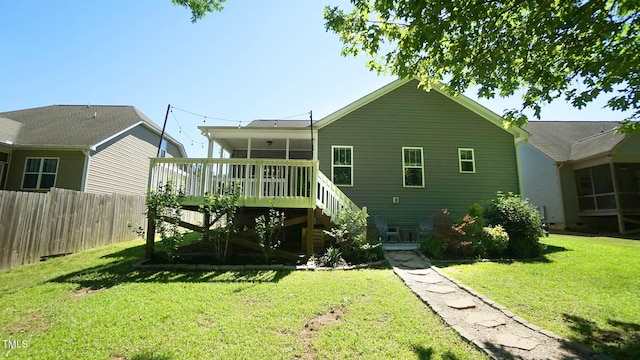 65 Wood Green Dr, Wendell, NC 27591 - rear view of house featuring a yard, fence, stairs, and a wooden deck