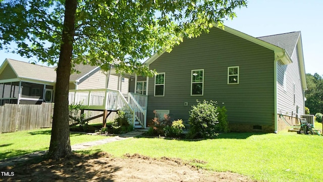 65 Wood Green Dr, Wendell, NC 27591 - rear view of property with a sunroom, a yard, crawl space, and stairway
