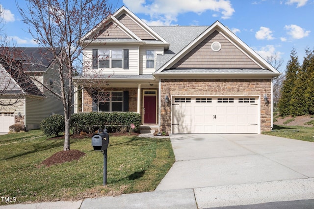 craftsman house with a front yard, driveway, a garage, stone siding, and a shingled roof