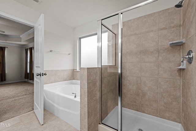 bathroom with a shower stall, a garden tub, tile patterned floors, and ornamental molding
