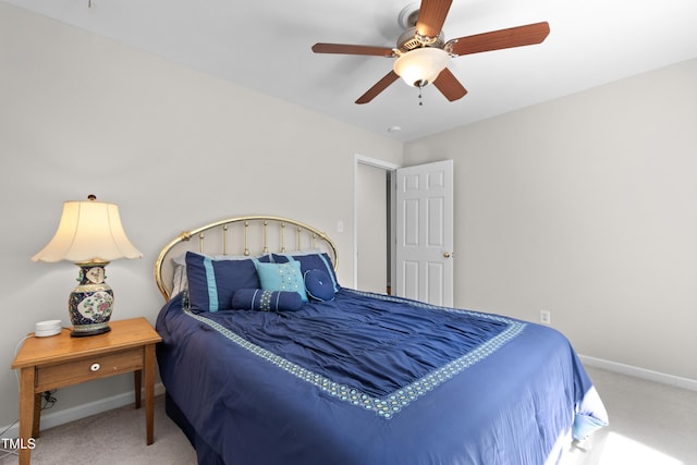 bedroom with carpet floors, baseboards, and a ceiling fan