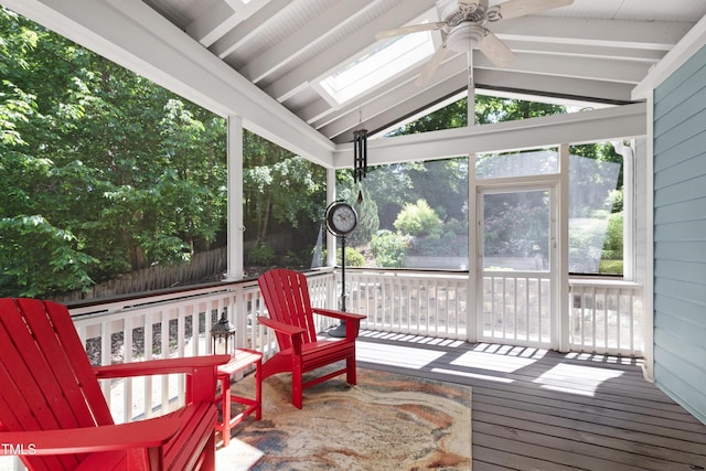 sunroom / solarium featuring ceiling fan and a skylight