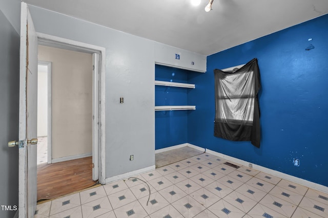 unfurnished bedroom featuring baseboards