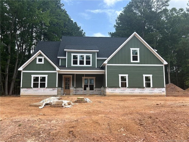 194 Landon Rdg, Sanford, NC 27330 - view of front of house featuring board and batten siding, a porch, and a shingled roof