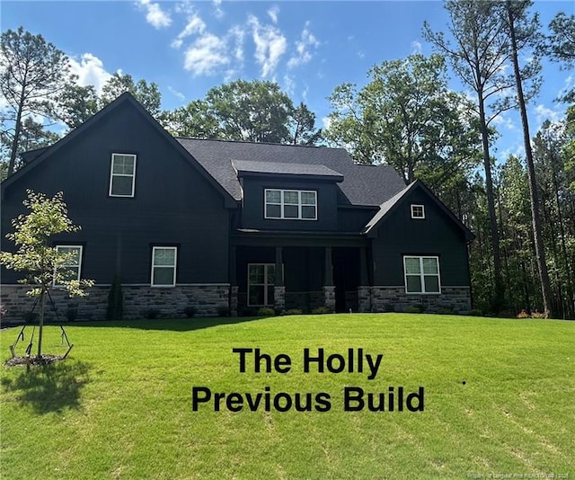 194 Landon Rdg, Sanford, NC 27330 - view of front of property with stone siding and a front yard