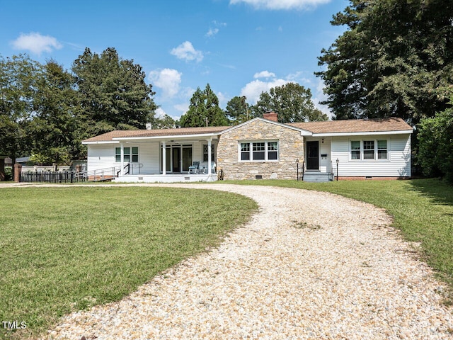 ranch-style home with covered porch, crawl space, a chimney, curved driveway, and a front yard