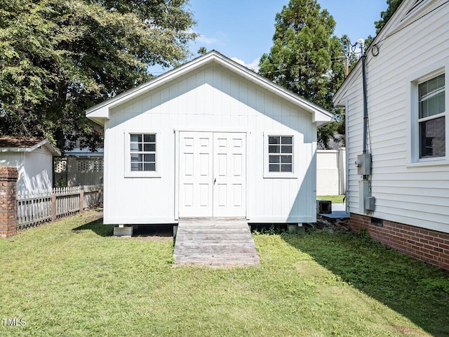 view of shed with fence