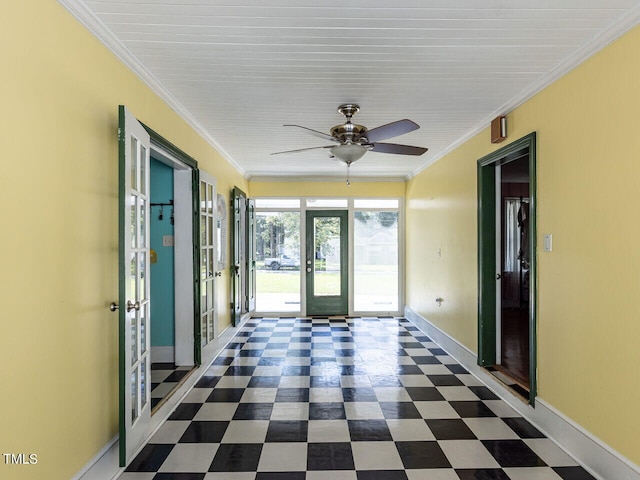 interior space featuring baseboards, tile patterned floors, french doors, and crown molding