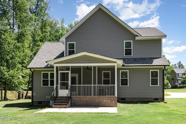 91 Carsons Creek Trl, Wendell, NC 27591 - rear view of property featuring crawl space, a lawn, a shingled roof, and a sunroom