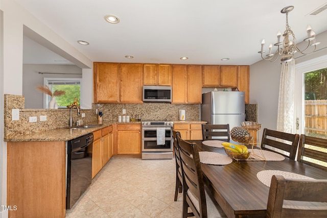 776 Averasboro Dr, Clayton, NC 27520 - kitchen featuring a wealth of natural light, appliances with stainless steel finishes, visible vents, and a sink
