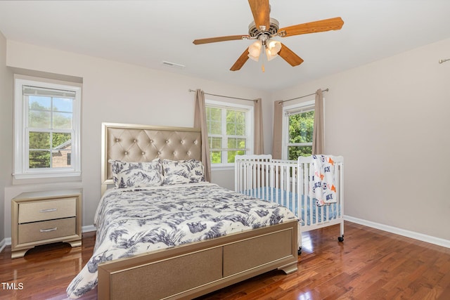 776 Averasboro Dr, Clayton, NC 27520 - bedroom with baseboards, visible vents, and wood finished floors