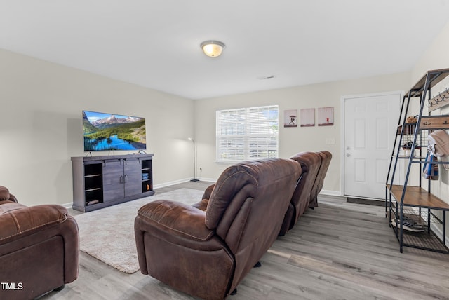 4108 Lady Slipper Ln, Durham, NC 27704 - living room with light wood-type flooring and baseboards