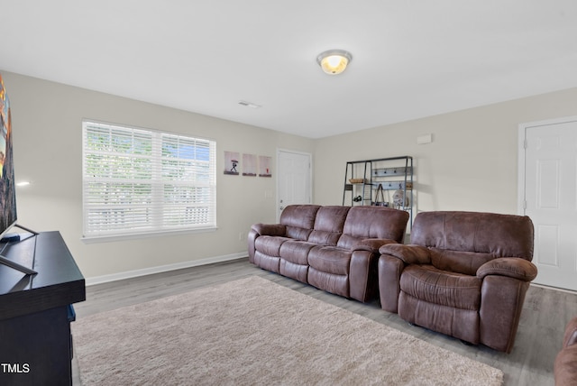 4108 Lady Slipper Ln, Durham, NC 27704 - living area featuring wood finished floors and baseboards