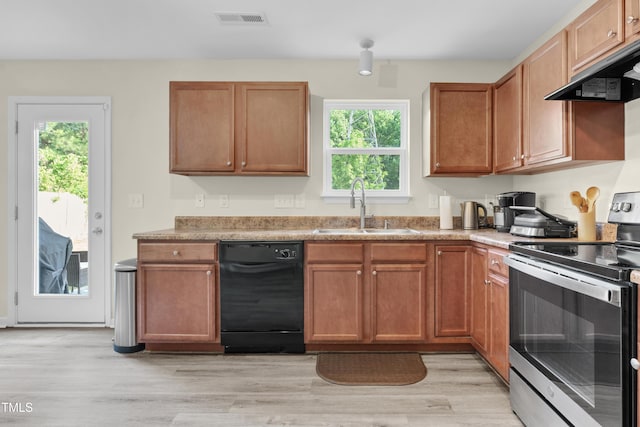 4108 Lady Slipper Ln, Durham, NC 27704 - kitchen featuring electric stove, black dishwasher, a sink, under cabinet range hood, and plenty of natural light