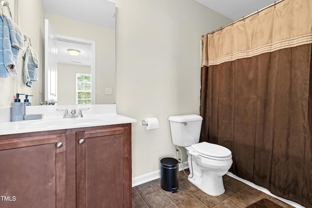 4108 Lady Slipper Ln, Durham, NC 27704 - full bathroom featuring tile patterned flooring, toilet, vanity, baseboards, and a shower with curtain