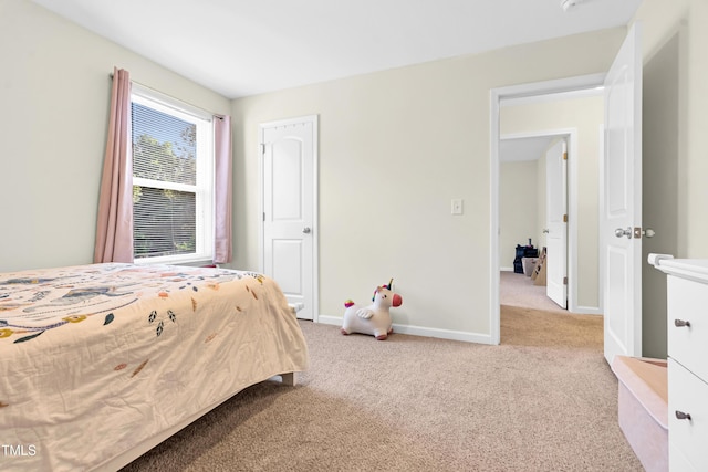 4108 Lady Slipper Ln, Durham, NC 27704 - carpeted bedroom featuring baseboards