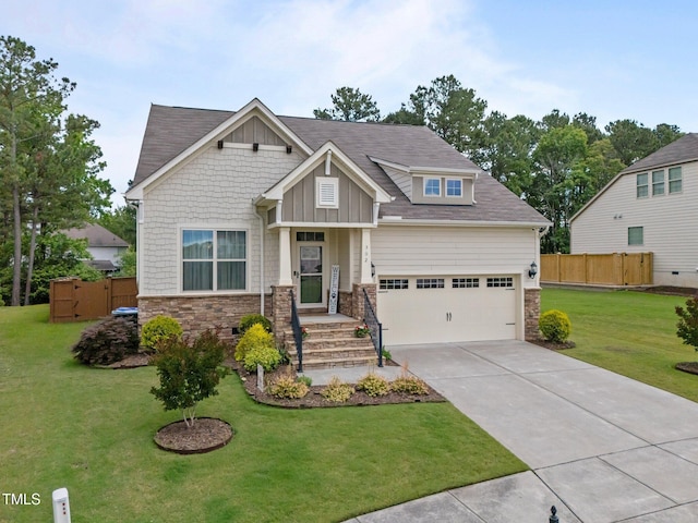 302 Kinney Glenn Ct, Durham, NC 27713 - craftsman house featuring stone siding, concrete driveway, and board and batten siding