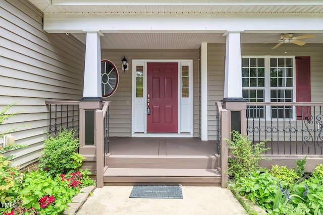 entrance to property featuring ceiling fan and a porch