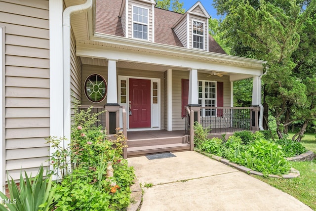 view of exterior entry with covered porch and ceiling fan