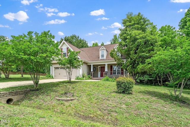 view of front facade with covered porch, driveway, a front yard, and an attached garage