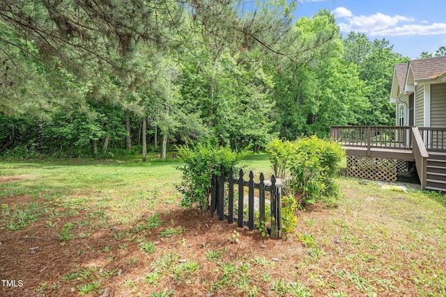 view of yard featuring a wooden deck