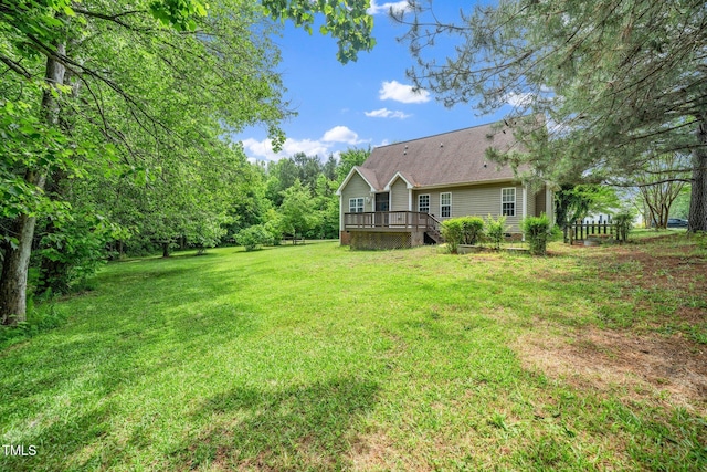 view of yard featuring a wooden deck