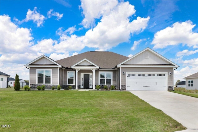 5082 Dogwood Dr, Battleboro, NC 27809 - craftsman-style home featuring stone siding, driveway, an attached garage, a front yard, and board and batten siding