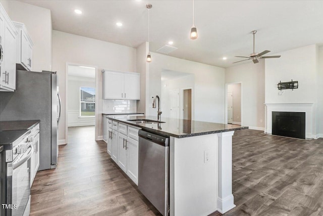 5082 Dogwood Dr, Battleboro, NC 27809 - kitchen with a sink, appliances with stainless steel finishes, ceiling fan, dark wood-style floors, and a kitchen island with sink