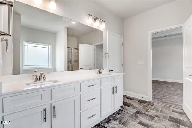 5082 Dogwood Dr, Battleboro, NC 27809 - full bathroom featuring a stall shower, double vanity, and baseboards