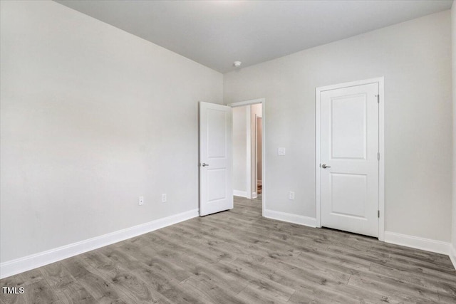 5082 Dogwood Dr, Battleboro, NC 27809 - unfurnished bedroom featuring wood finished floors and baseboards
