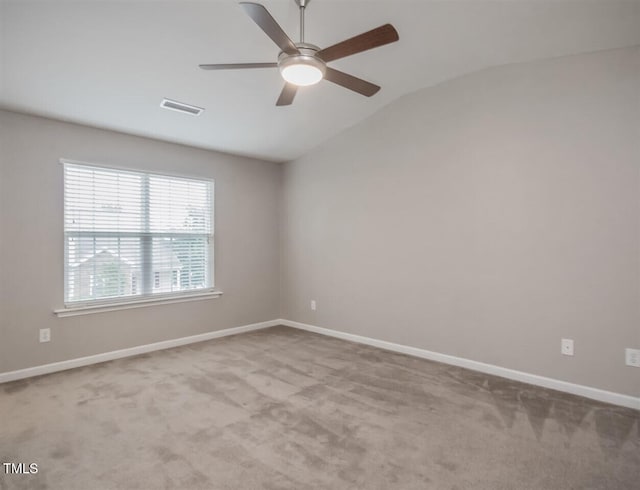 8219 Martello Ln, Raleigh, NC 27613 - spare room with lofted ceiling, ceiling fan, visible vents, and carpet