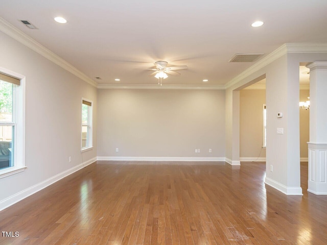 unfurnished room featuring wood-type flooring, healthy amount of natural light, a ceiling fan, ornamental molding, and recessed lighting
